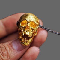 Pendentif crane doré