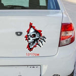 Stickers tete de mort souriante sortant d’un trou 13*17cm - 